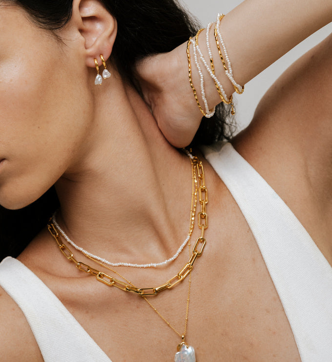 Nura Keshi Pearl Huggie Earrings