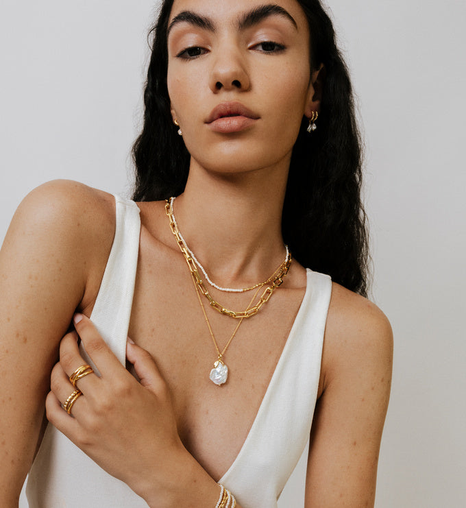 Nura Keshi Pearl Huggie Earrings