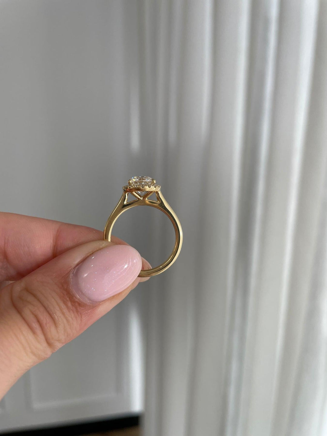 a person holding a ring in their hand