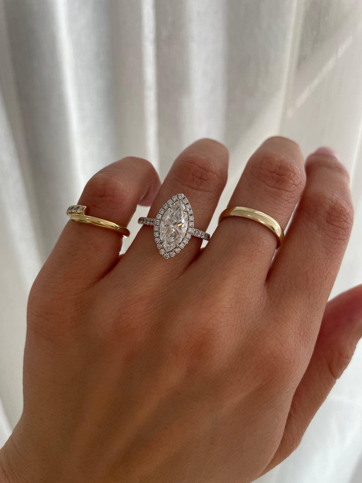 a woman's hand with two rings on it