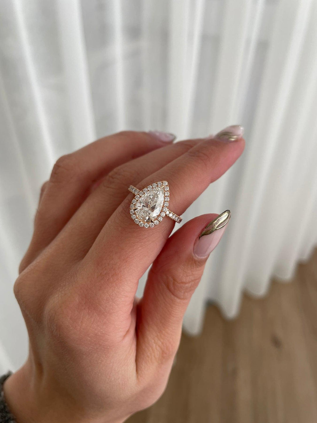 a woman's hand with a ring on it