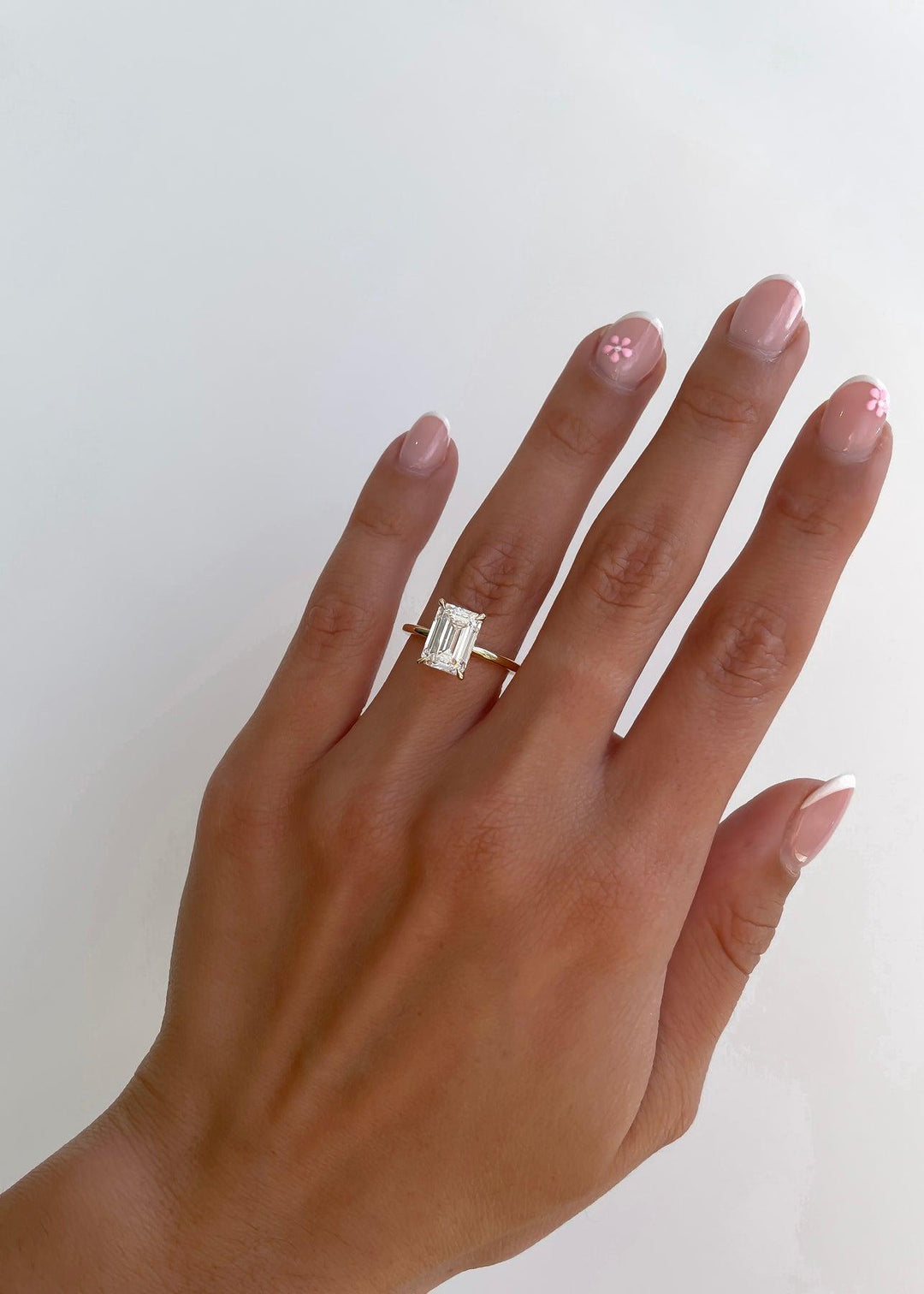 a woman's hand with a ring on it