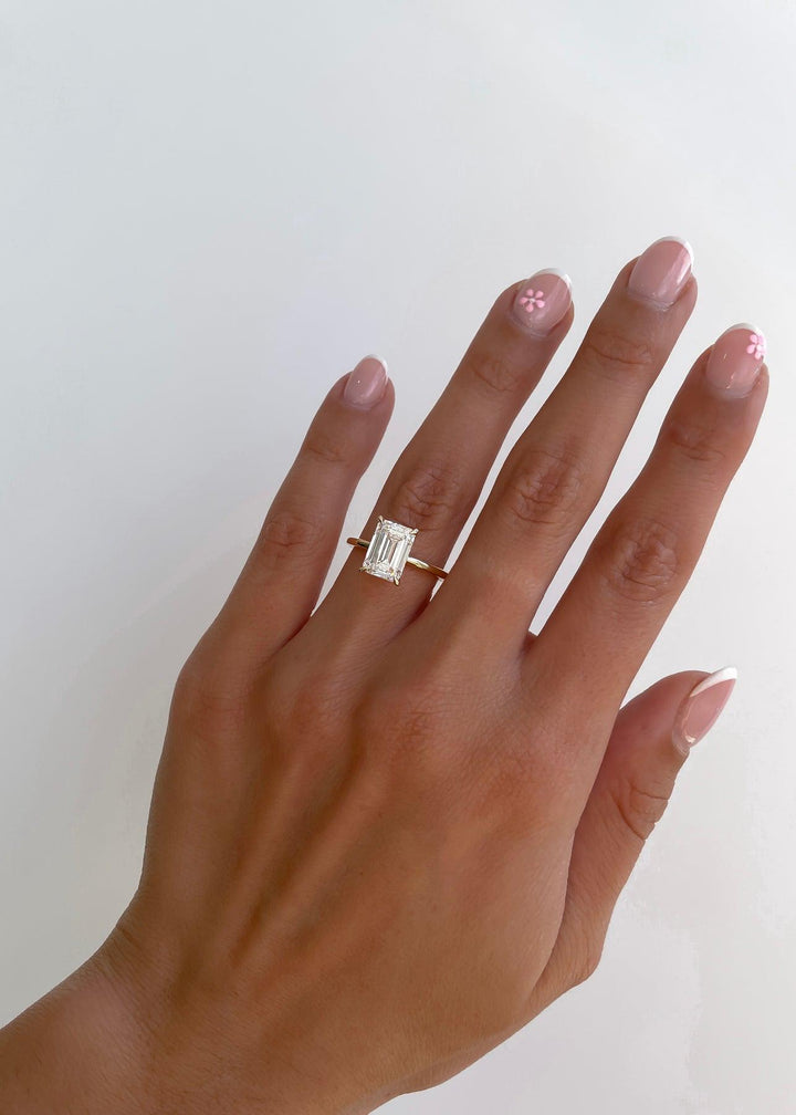 a woman's hand with a ring on it