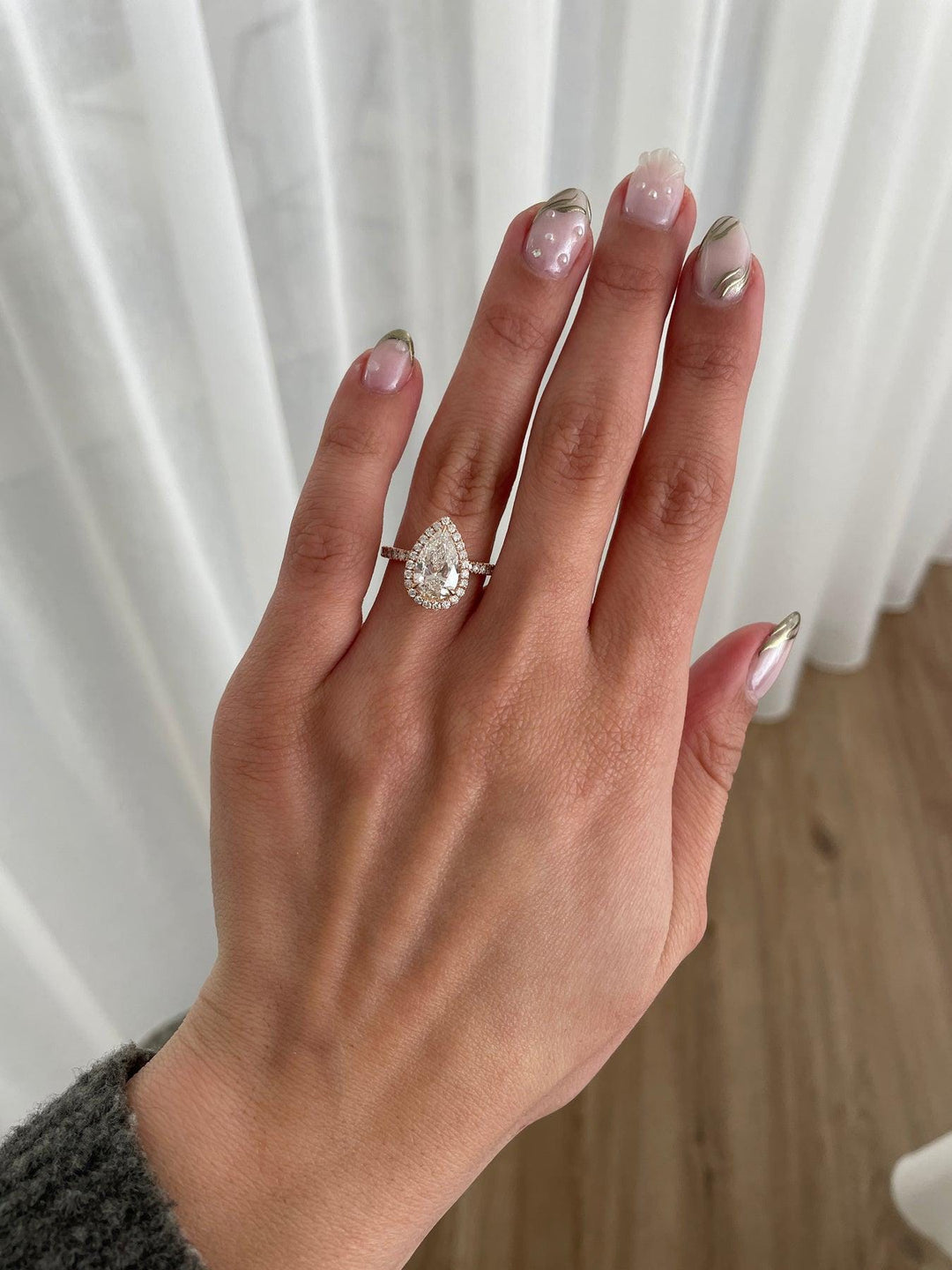 a woman's hand with a ring on it
