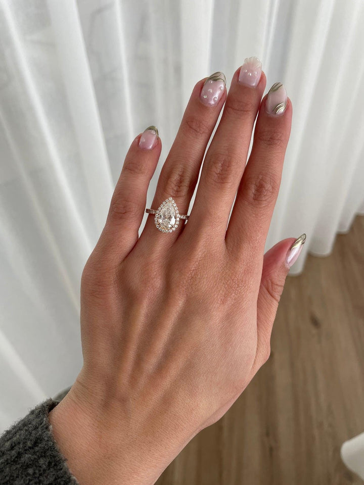 a woman's hand with a ring on it
