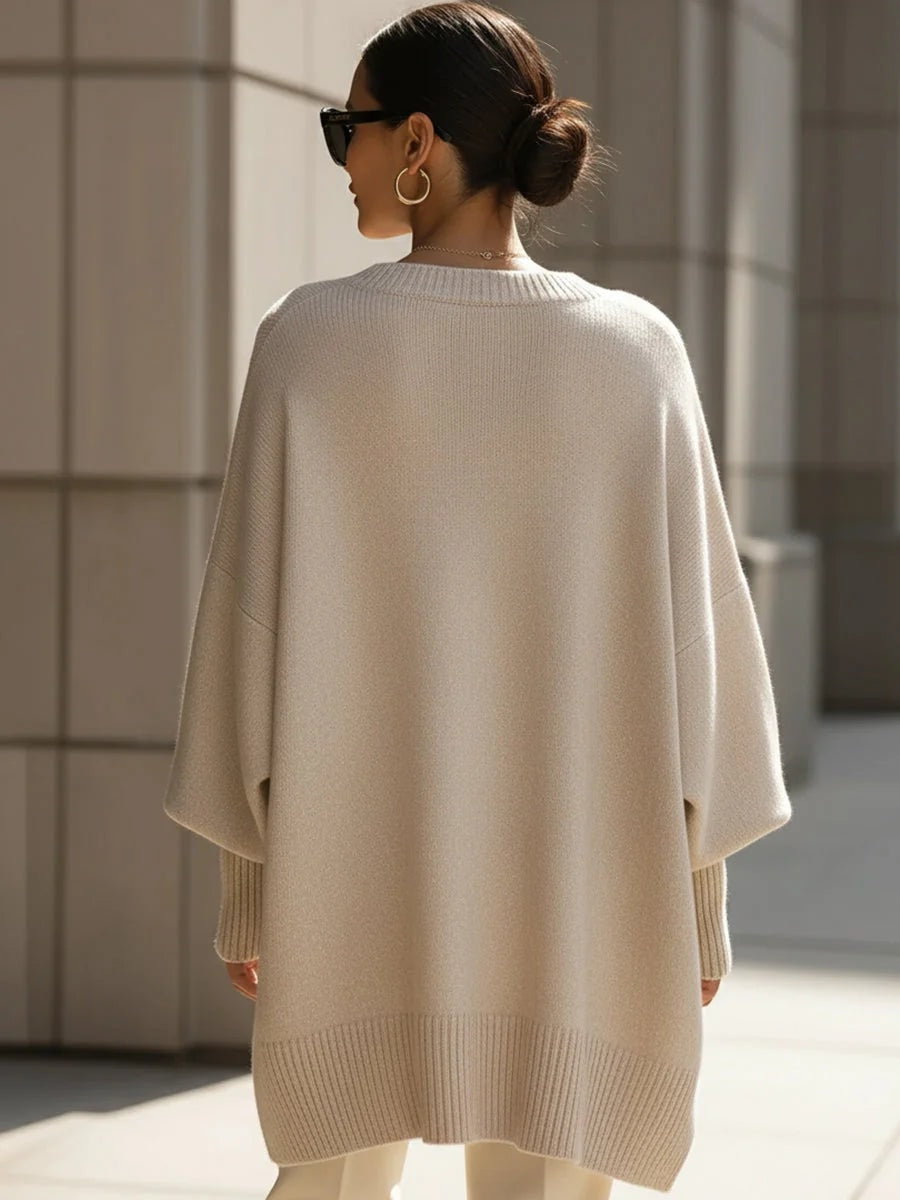 Bagside af oversized strikbluse til damer med flagermusærmer