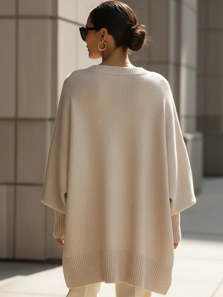 Bagside af oversized strikbluse til damer med flagermusærmer