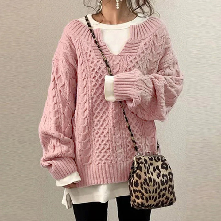 Lyserød oversized strikbluse til damer med v hals og snoninger