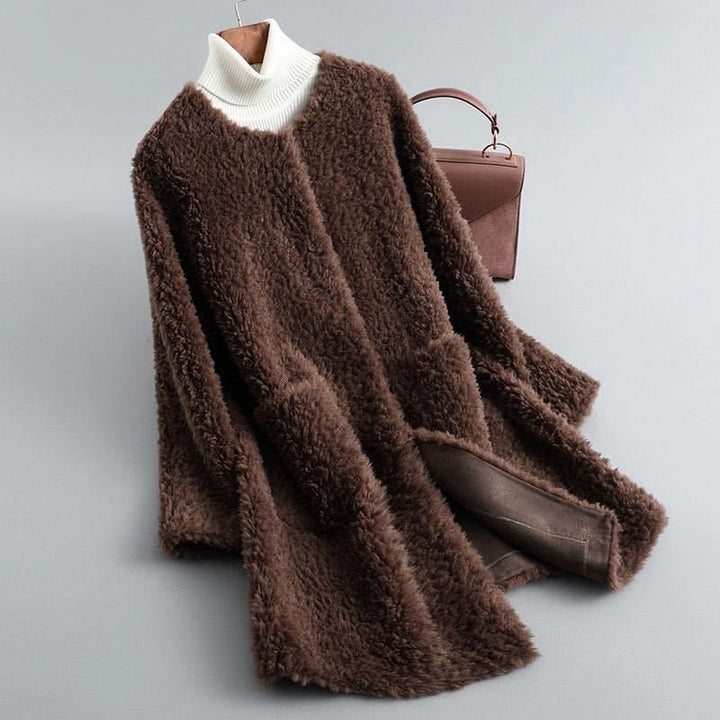 Teddy frakke dame i shearling med lommer og rund hals