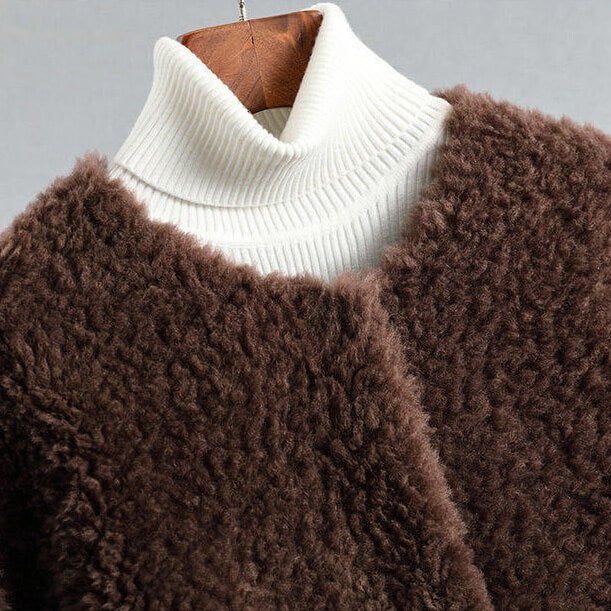 Teddy frakke dame i shearling med lommer og rund hals